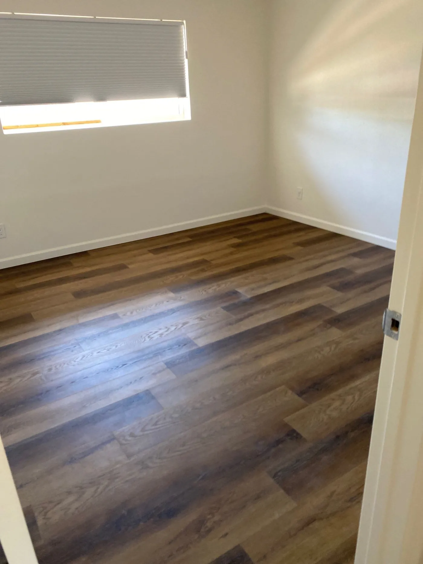 New wood-plank flooring installed by AHS Builders