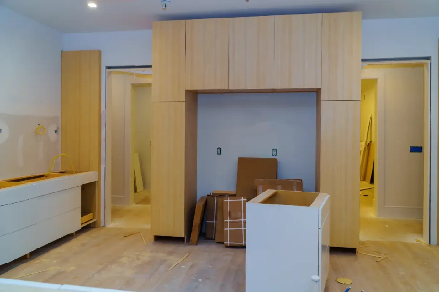 Custom light-wood cabinetry installed by AHS Builders
